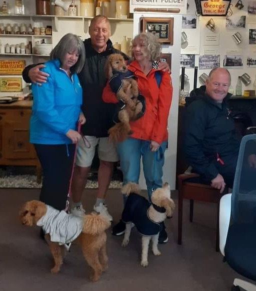 Four adult visitors, with their 3 dogs in Fordingbridge Museum