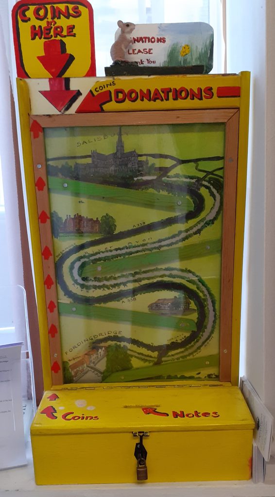 Donation box with river slide.