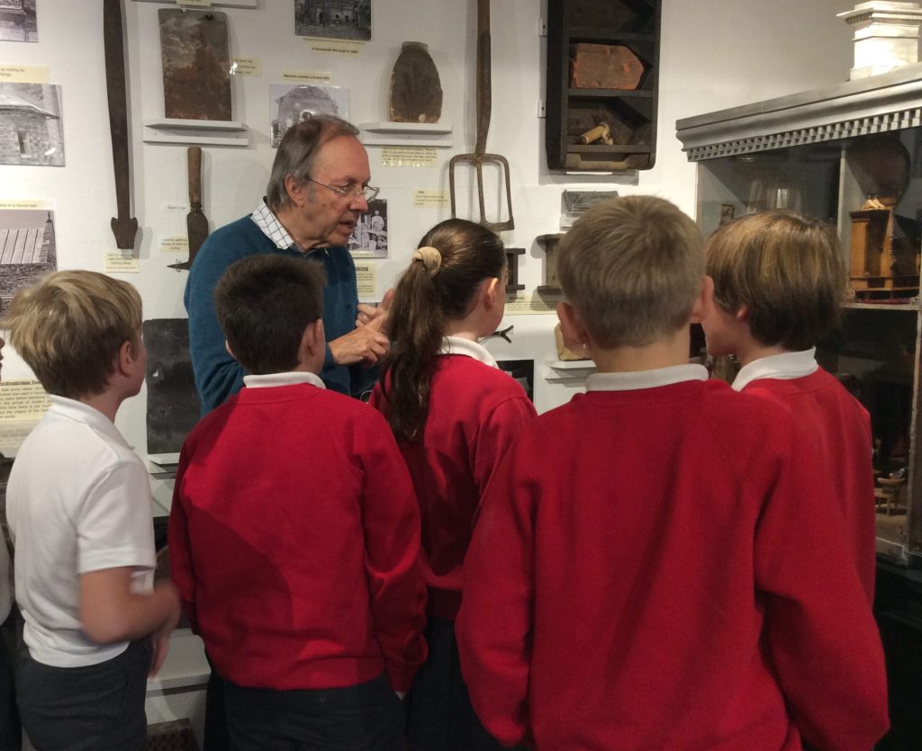 Julian talking to pupils from Western Downland School by a display