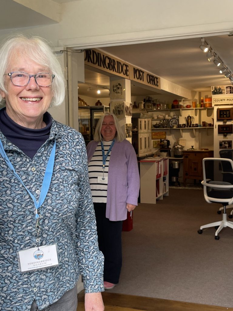 Two volunteer stewards at the entrance of Fordingbridge Musuem.